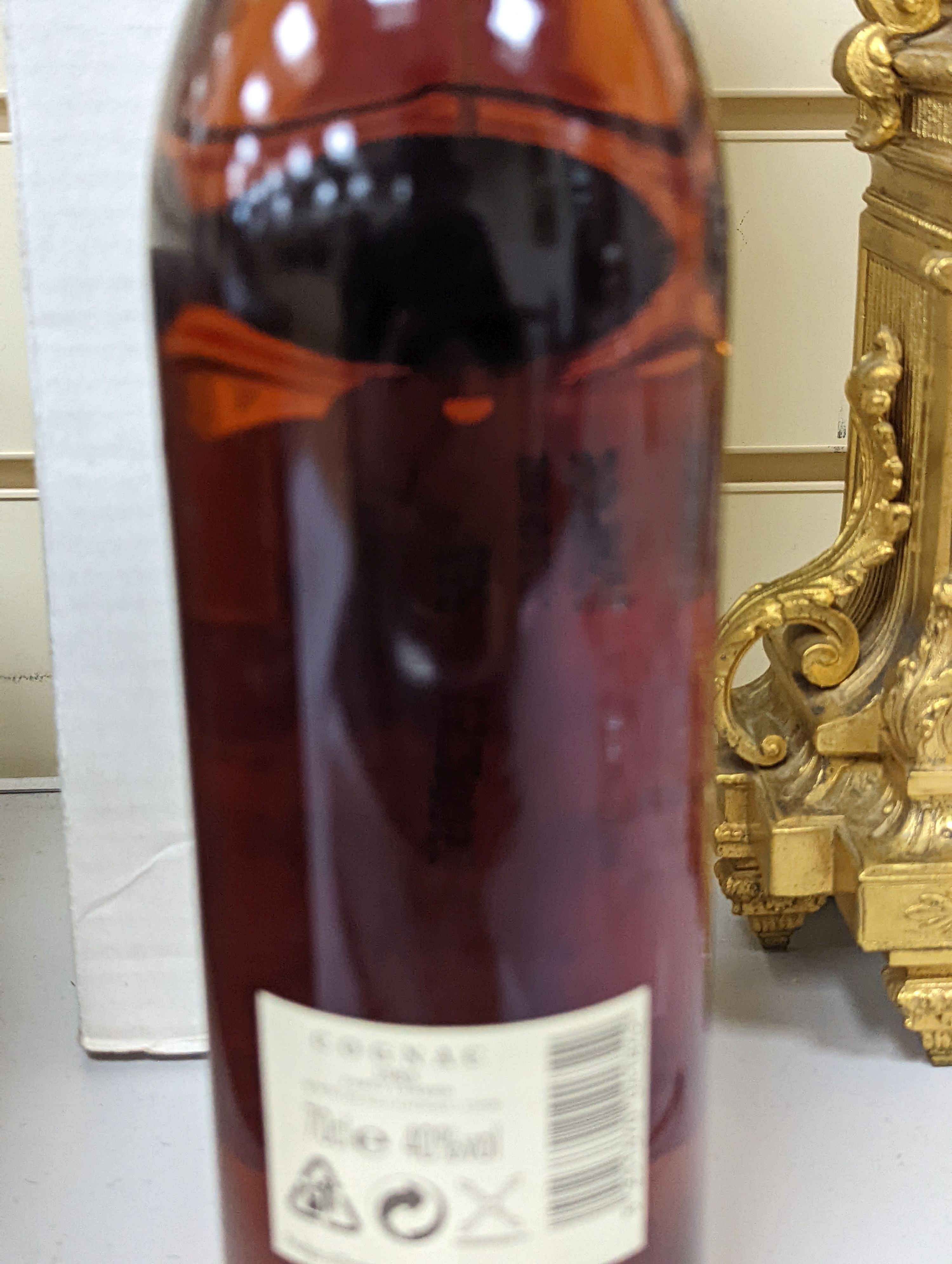 One bottle of Hine Grand Champagne Cognac, 1975. Original cardboard box.